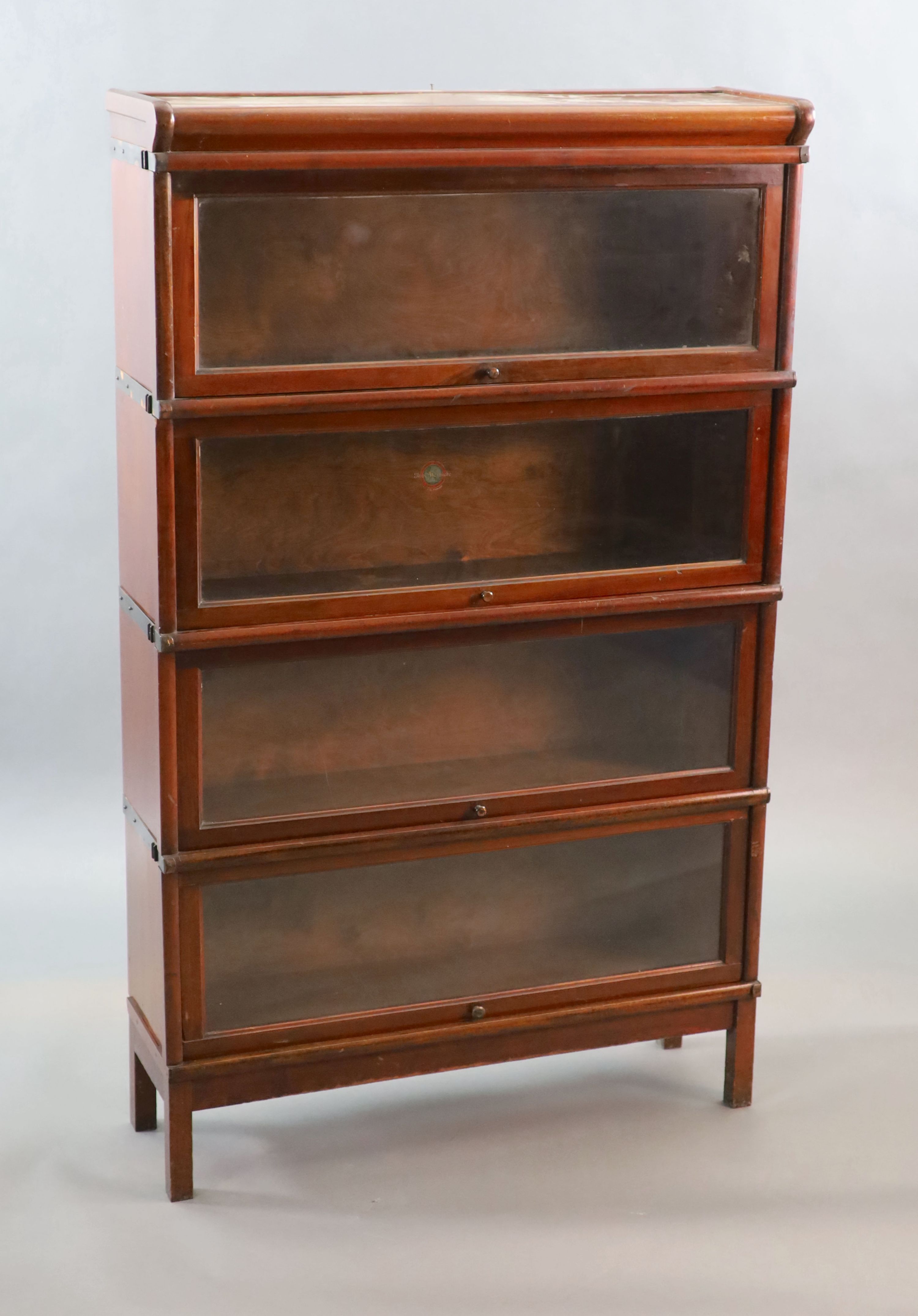 A Globe Wernicke mahogany four section bookcase, W.86.5cm D.27cm H.143cm